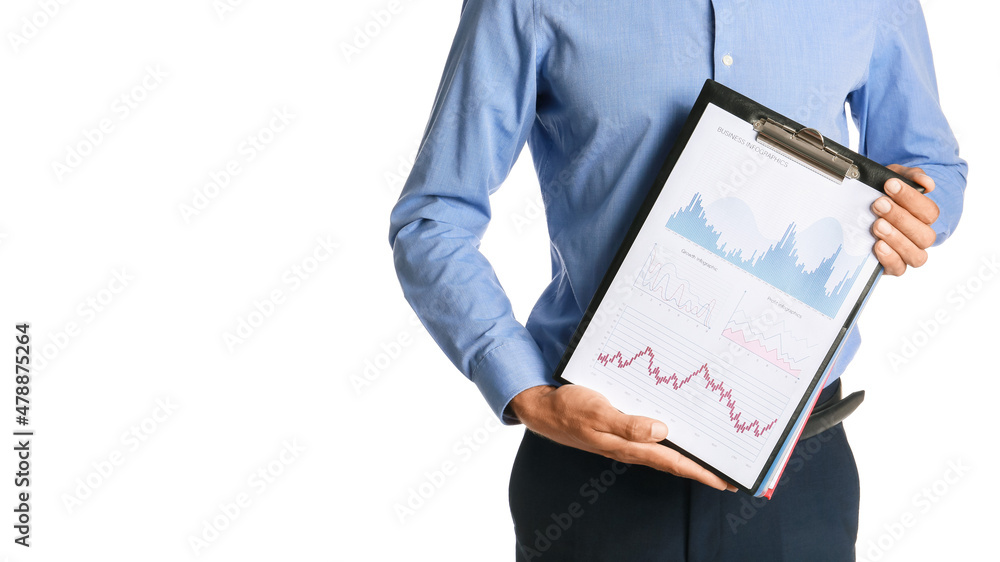 Businessman holding clipboard with with diagrams on white background