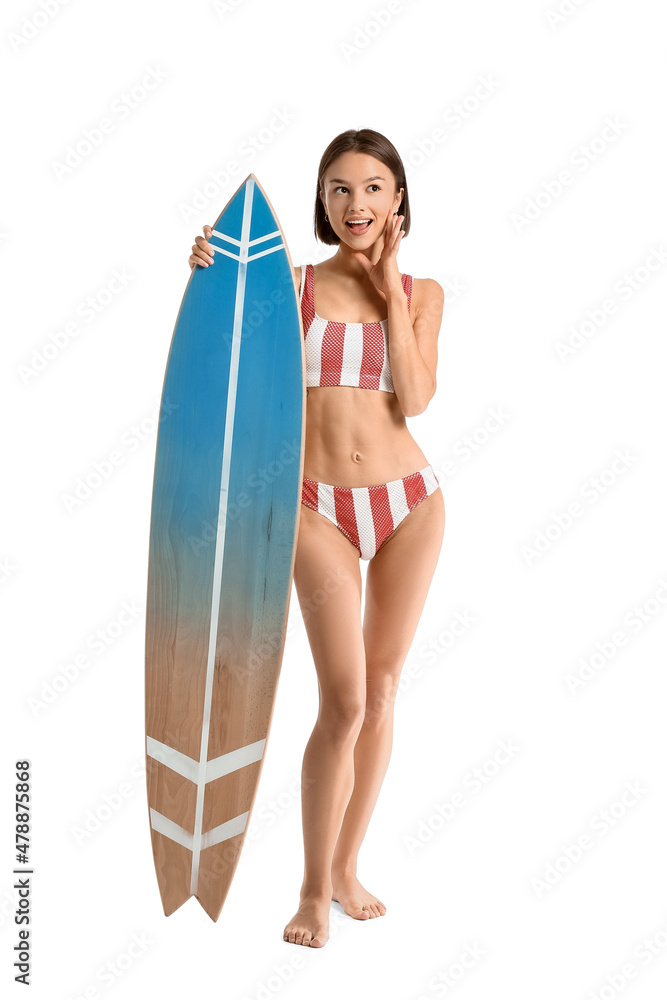 Beautiful young woman with surfboard on white background