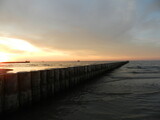 Fototapeta Morze - Beautiful sunset on the Baltic Sea. A walk along the seashore during your vacation. Perfect wallpaper.