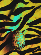 Decoupage Easter Egg DIY Hadmade Wrapped In A Black And White Typographic Paper On A Colorful Iridescent Zebra Patterned Paper / Fabric