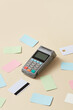 © Yaroslav Danylchenko/Stocksy - POS terminal with colorful credit cards in studio