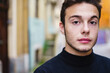 © Daniel Gonzalez/Stocksy - Portrait of a young man on the street