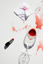 Broken Wineglass And Lipstick On Table