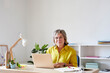 © ALTO IMAGES/Stocksy - Smiling mature businesswoman in office