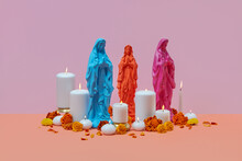 Virgin Mary Statues With Candles And Flowers