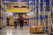 © Raymond Forbes LLC/Stocksy - Manager walking with employee in warehouse