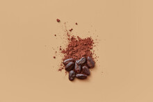 Cocoa Powder And Beans On Beige Background