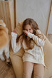 © Tatiana Timofeeva/Stocksy - Kid Playing With a dog