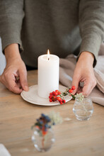 Woman Holding A Christmas Candle