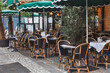 © Anna Berkut/Stocksy - cozy cafe terrace in Paris, France