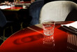 © Irina Ozhigova/Stocksy - Glass on a red table