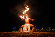 © Igor Kardasov/Stocksy - shamanic fire ritual in modern city
