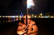 © Igor Kardasov/Stocksy - Latino man doing fireshow