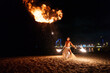 © Igor Kardasov/Stocksy - tribal man blows huge balls of fire