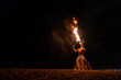 © Igor Kardasov/Stocksy - performer blowing on burning fire
