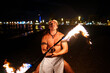 © Igor Kardasov/Stocksy - Latin performer spinning fire rod