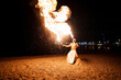 © Igor Kardasov/Stocksy - Tribal latin man spits  huge fire