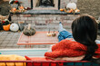 © Tana Teel/Stocksy - woman relaxing in front of outdoor fireplace