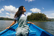 © Kike Arnaiz/Stocksy - Calm Arab woman floating in boat