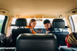 © Studio Firma/Stocksy - Family Driving in Car
