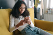 © Ani Dimi/Stocksy - Girl on mobile phone