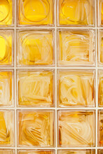 A Part Of Dirty Wall Made With Yellow Glass Blocks