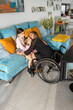 © Santi Nuñez/Stocksy - Mother in wheelchair playing with her daughter