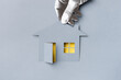 © CACTUS Creative Studio/Stocksy - Hand holding a house
