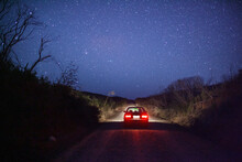 A Car Under A Clear, Starry Night Sky. 