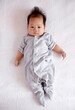 © ChaoShu Li/Stocksy - Asian newborn baby in bed,