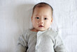 © ChaoShu Li/Stocksy - Closeup expression of Asian newborn baby