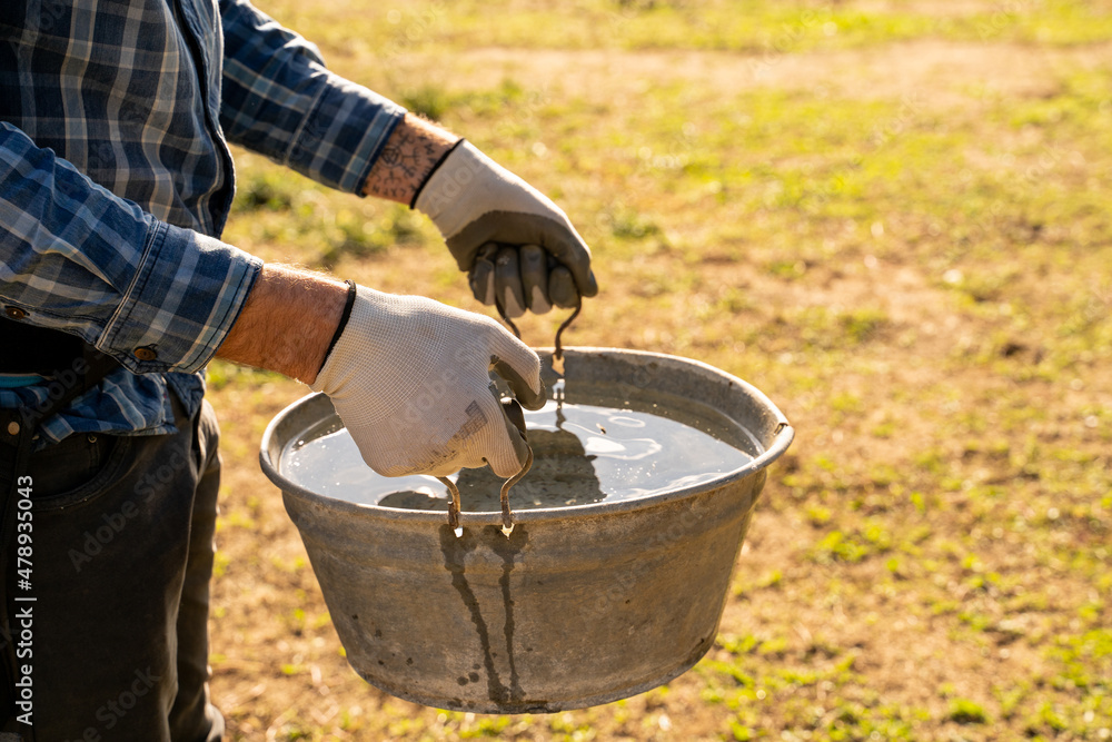 Farmer holding water cube