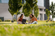 © Mauro Grigollo/Stocksy - Women meet in a park to work