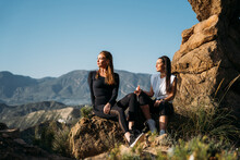Young Women Taking Break In Mountains