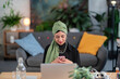 © Studio Marmellata/Stocksy - Arab freelancer using cellphone during break