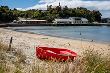 A Red Dinghy Tied Up On Photographs Taken In Thompson Bay