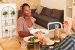 © Ivan Gener/Stocksy - Woman and her husband eating dinner at home