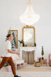 © Alina Hvostikova/Stocksy - Man walking in elegant decorated apartment