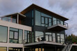 © Raymond Forbes LLC/Stocksy - Glass on Modern Home by the Ocean