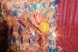 © Liliya Rodnikova/Stocksy - Anonymous woman in shiny dress holding macaroons