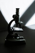 © Vera Lair/Stocksy - Small Microscope On A dark background