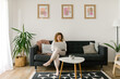 © STUDIO TAURUS/Stocksy - Smiling woman entrepreneur working from home online