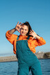 © Alba Vitta/Stocksy - Portrait of cute fun young woman posing and dancing