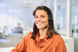 Leinwandbild Motiv Smiling business woman with headset in call center
