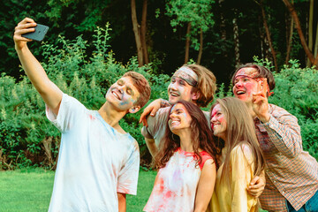 Canvas Print - friends at holi fest taking selfie on the phone