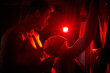 Adult sex bdsm games. Couple playing sexual games. Man and woman tied with a rope. Sexual relations. Passionate hugs love game. Young sexy couple on a dark background with beautiful red light