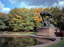 Fryderyk Chopin Monument In Autumn Scenery Of The Royal Lazienki Park In Warsaw, Poland, Designed Around 1904 By Waclaw Szymanowski