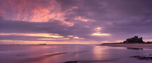 Sunrise Over Bamburgh Castle And The Farne Islands, Northumberland