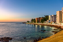 Seafront In The Tourist Region Of The City Of Salvador In Bahia During Sunset With The Sea, Buildings, Streets And Sidewalks