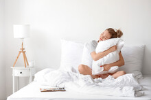 Morning Of Beautiful Woman Hugging Pillow On Bed